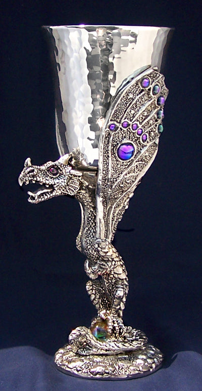 hammered pewter dragon goblet with dragon as based and gem colored wings wrapped around pewter dragon goblet.