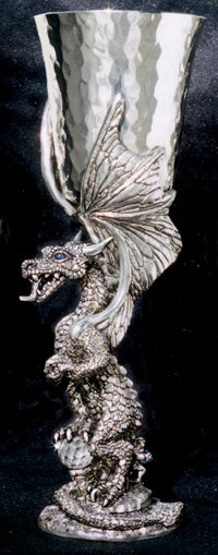 standing hammered pewter dragon goblet with 1 foot of dragon on a crystal ball and wings wrapped around pewter goblet