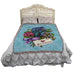 "Je t'aime" letter and flower bouquet blanket displayed on a bed
