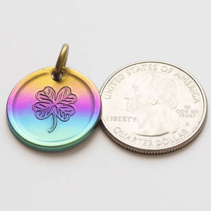 Rainbow lucky coin charm showing US quarter for scale