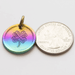 Rainbow lucky coin charm showing US quarter for scale