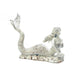 Mermaid wine bottle holder shown without any wine, laying in the surf with her tail in the air. Has a rustic, whitewashed look