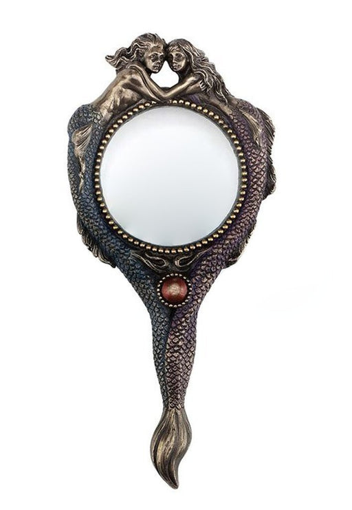Magnifying glass featuring a merman and mermaid at the top, their tales forming the handle