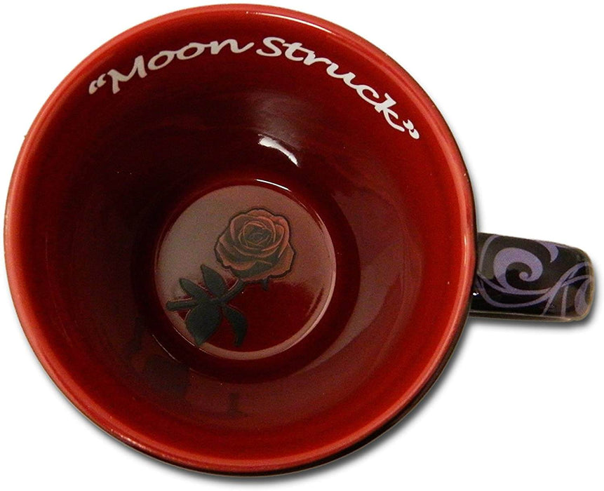 Interior of mug, red with crimson rose at the bottom and title of the art written, "Moon Struck", in white