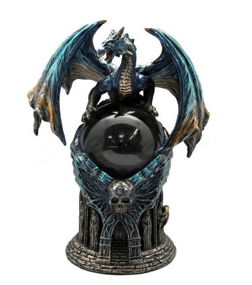 Dragon with blue-orange wings sits atop a glass crystal ball, which rests on a skull-topped spooky temple