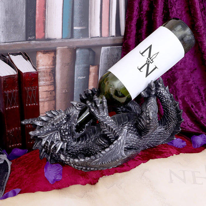 Dragon wine bottle holder shown on display with a bottle