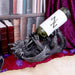Dragon wine bottle holder shown on display with a bottle