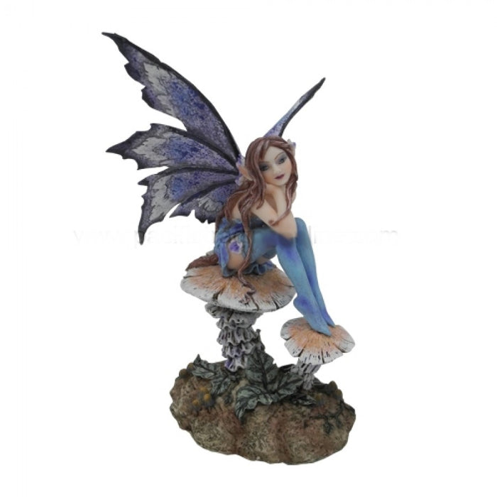 Fairy figurine - fairy in blue with indigo wings sits on a pair of mushrooms