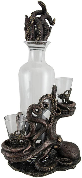 Decanter held in bronze-hued Octopus tentacles. To either side are matching shot glasses resting on more tentacle coils