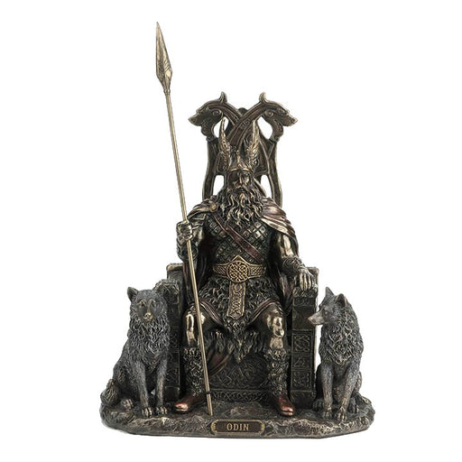 Norse god Odin sitting on a throne holding a spear. His wolves, Geri and Freki, sit to either side.