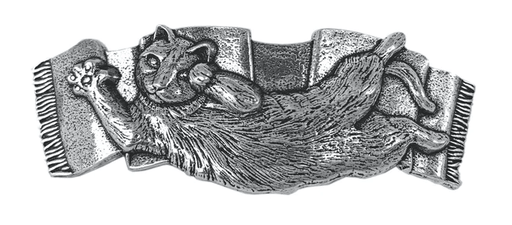 Metal hair clip barrette. A stretched out cat showing its tummy on a rug.