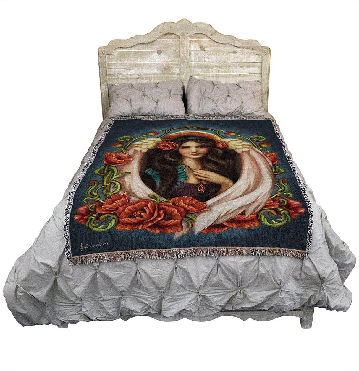 Poppy Angel tapestry blanket shown draped over a bed