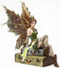 Fairy figurine with Steampunk wings sitting on luggage in green bodice and fishnets
