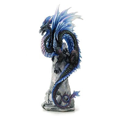 The dragon perches upon a rocky crag, mouth open and eyes alert. It has iridescent scales and accents of sapphire blue fading to white, reminiscent of snow and ice. Wings splay out above the dragon's back, and its tail curls and spirals gracefully down the rocks.