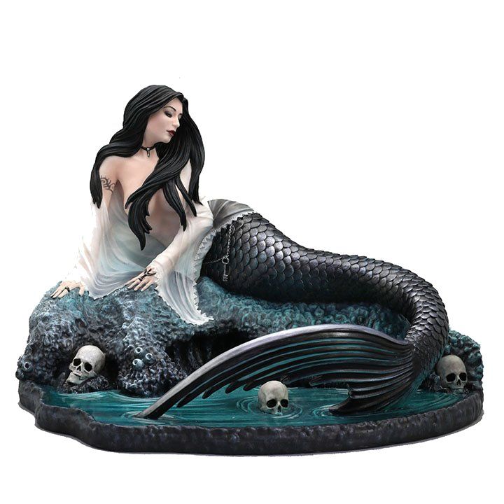 Mermaid with black hair and scales in pool of water with skulls