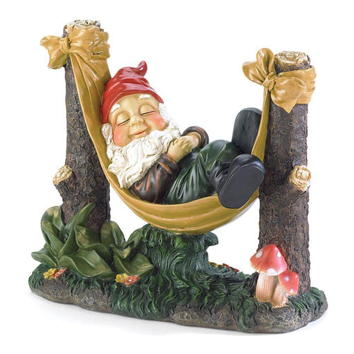 Garden figurine of a gnome sleeping in a hammock