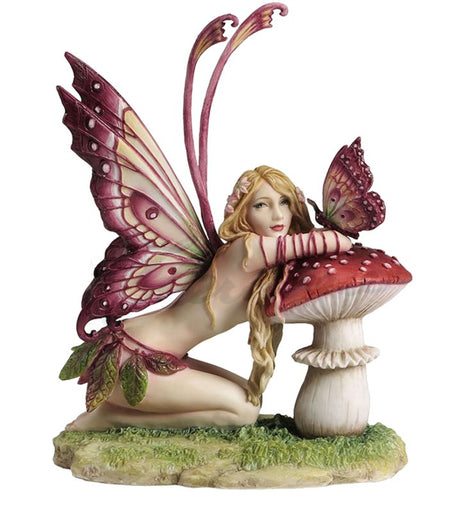 he pixie is clad in a skirt of leaves and has ornately detailed butterfly wings that match her little friend, a butterfly. They sit on a mushroom. Based on the art of Selina Fenech