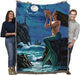 Nighttime mermaid tapestry blanket held by two adults to show large size