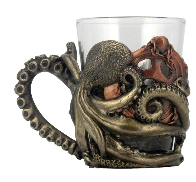 Shot glass with handle. The glass is encased in a Steampunk octopus design, where a tentacle forms the handle