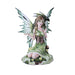 Figurine showing a fairy in green dress and brown corset with green and white wings. On her shoulder is an emerald green dragon, they sit in a meadow with yellow flowers