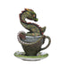 A green and brown dragon with leaf-like scales sits in a teacup!
