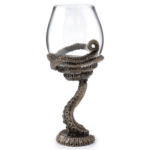Wineglass with octopus tentacle wrapped around it to form the stem