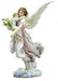 Figurine of an angel in pale pink holding a child and a bouquet of flowers