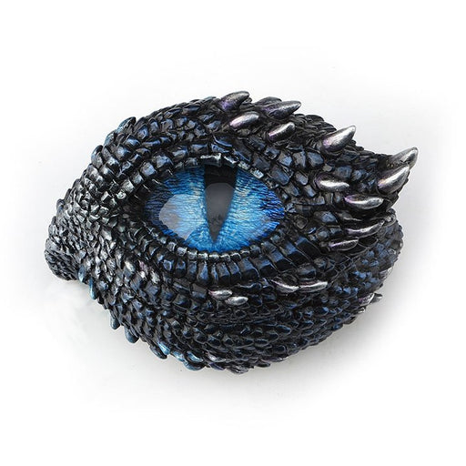Trinket box shaped like the eye of a dragon. Thorny scales surround the blue eye