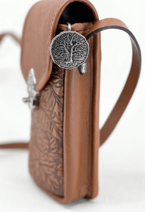 Tree of Life purse key hook shown on a brown leather bag