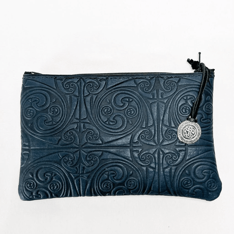 Treskelion leather zipper pouch with Celtic knot design and pewter zipper pull, shown in navy