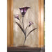 Purple lily flower candle holder displayed on a table with a lit tealight