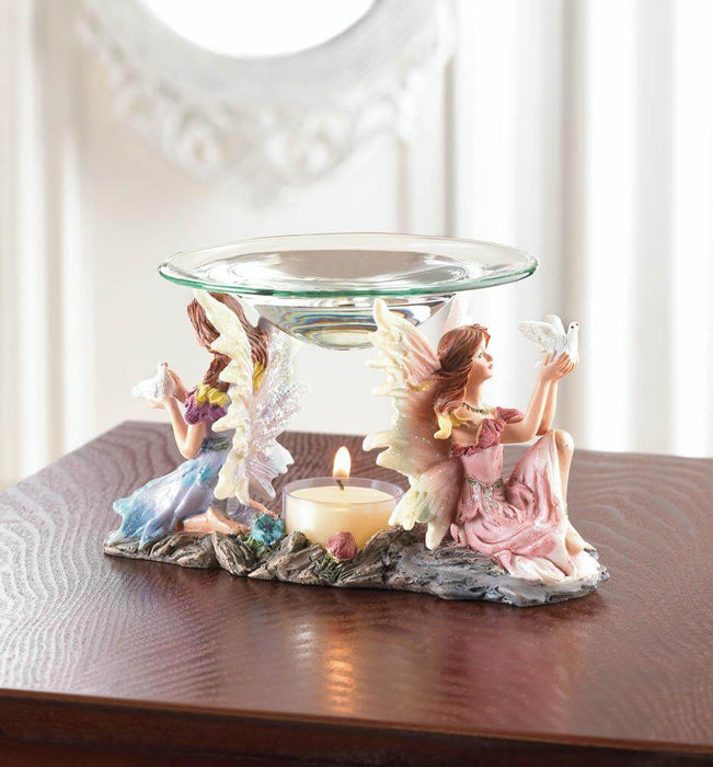 Twin fairy oil warmer displayed on a wooden table, with a lit tealight