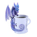 A blue-purple dragon peers up over the edge of a coffee mug to see what's inside