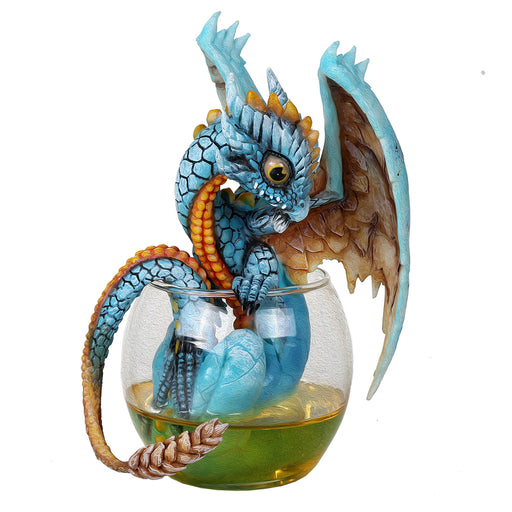 A blue and yellow dragon sits in a tumbler of whiskey