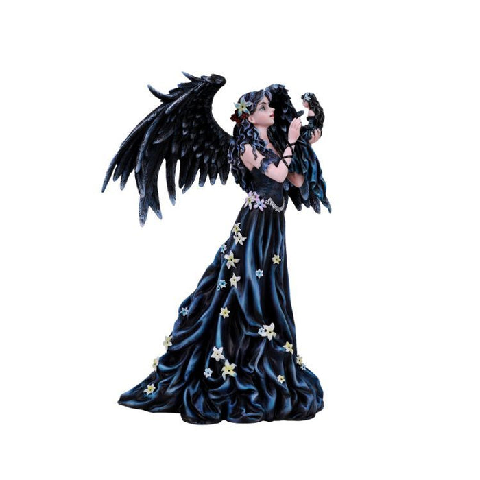 Angel fairy with black feathered wings and dress covered in flower blossoms. She holds up a doll of herself