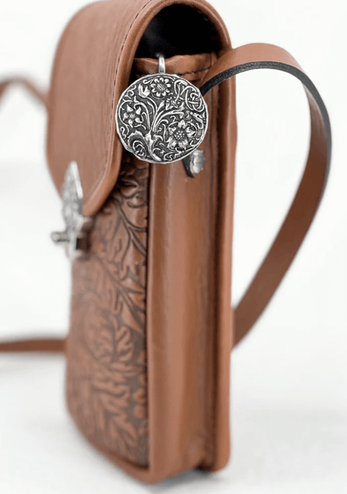 Wildflower purse key hook on a brown leather bag
