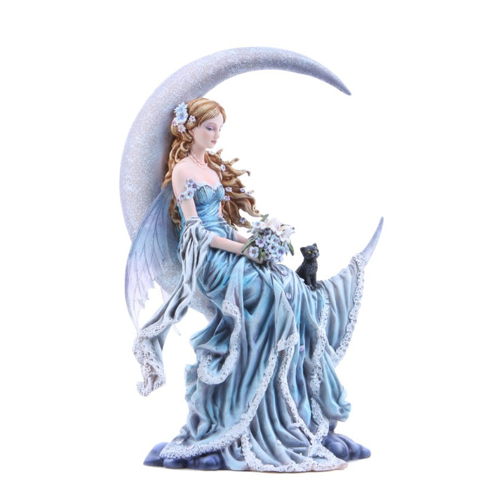 A fairy in a blue dress and wings to match sits on a crescent moon. She has light brown hair and holds a bouquet of blossoms, and a black cat sits with her
