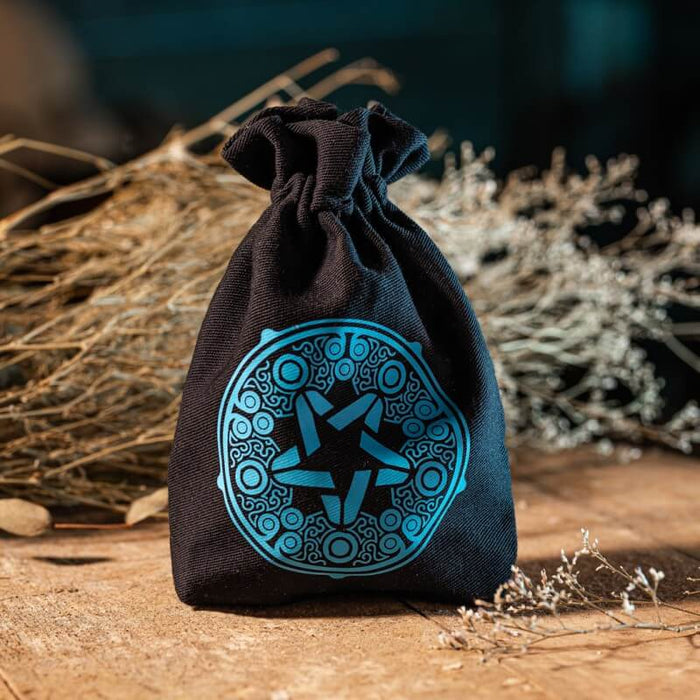 Yennefer Dice bag shown on a rustic table