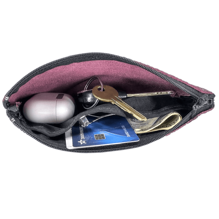 Leather wristlet pouch shown open to view size of items that can fit, shown with keys, cards, money. Internal pocket for organization