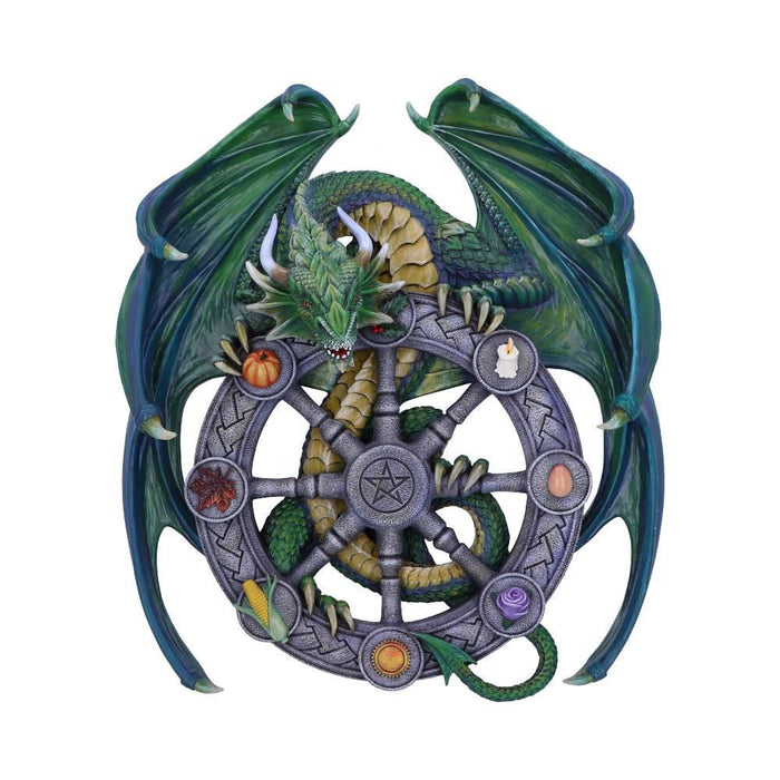 Wheel plaque featuring symbols of the season, with a green dragon perched on it